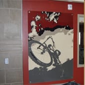 A painting of a bicycle on the wall