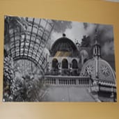 A black and white photo of a building with a dome.