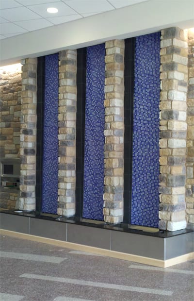 A wall with multiple blue and white tiles