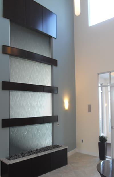 A wall with three strips of glass on it