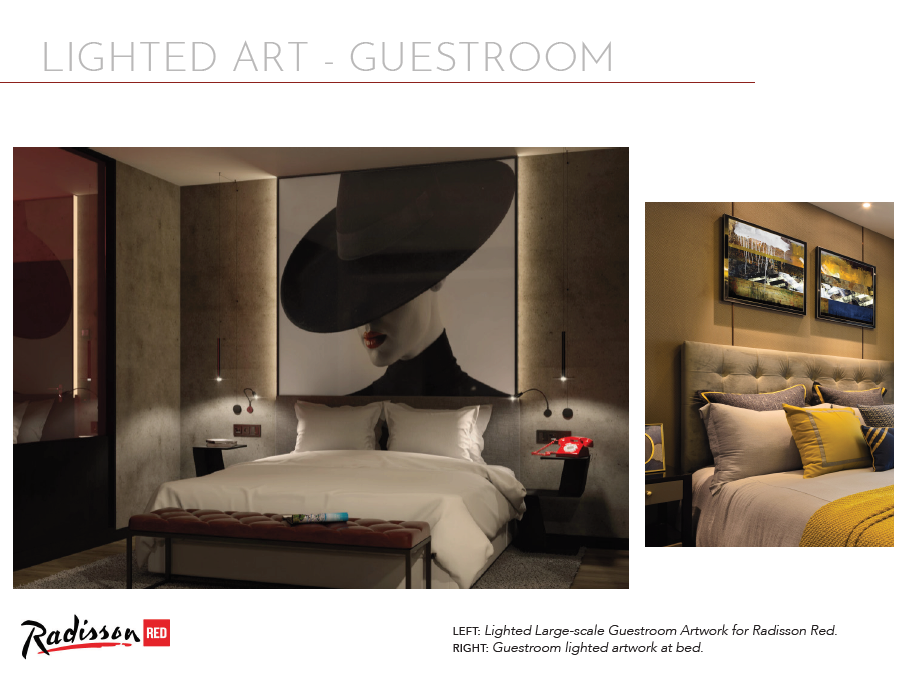A hotel room with two beds and a large picture.