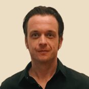 A man in black shirt and white background